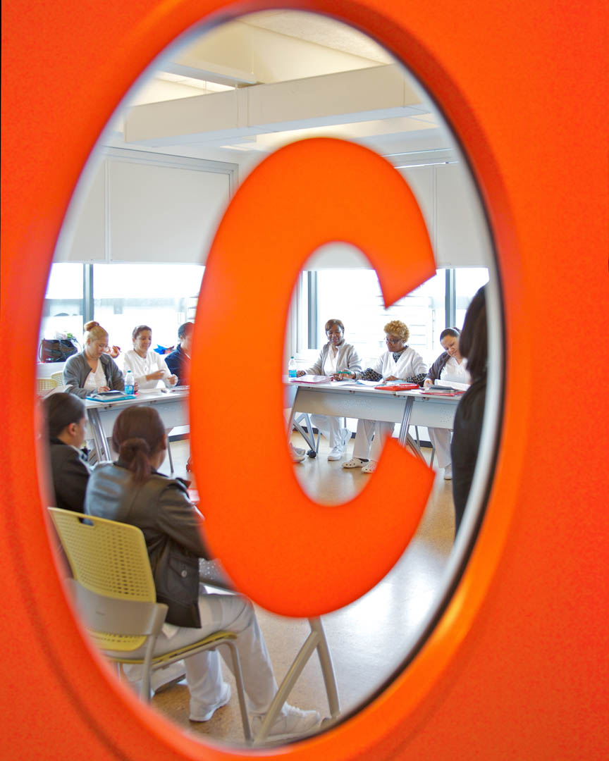 View through the a round window with "C" on it at CHCA training facilities